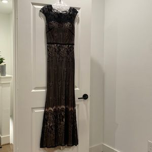 Royal Queen Collection elegant black lace floor length gown.